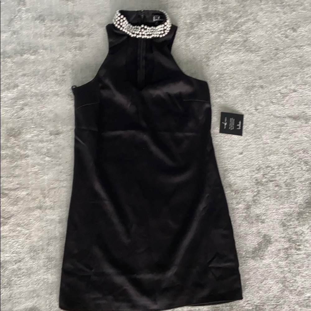 Black cocktail/evening dress with pearl neckless